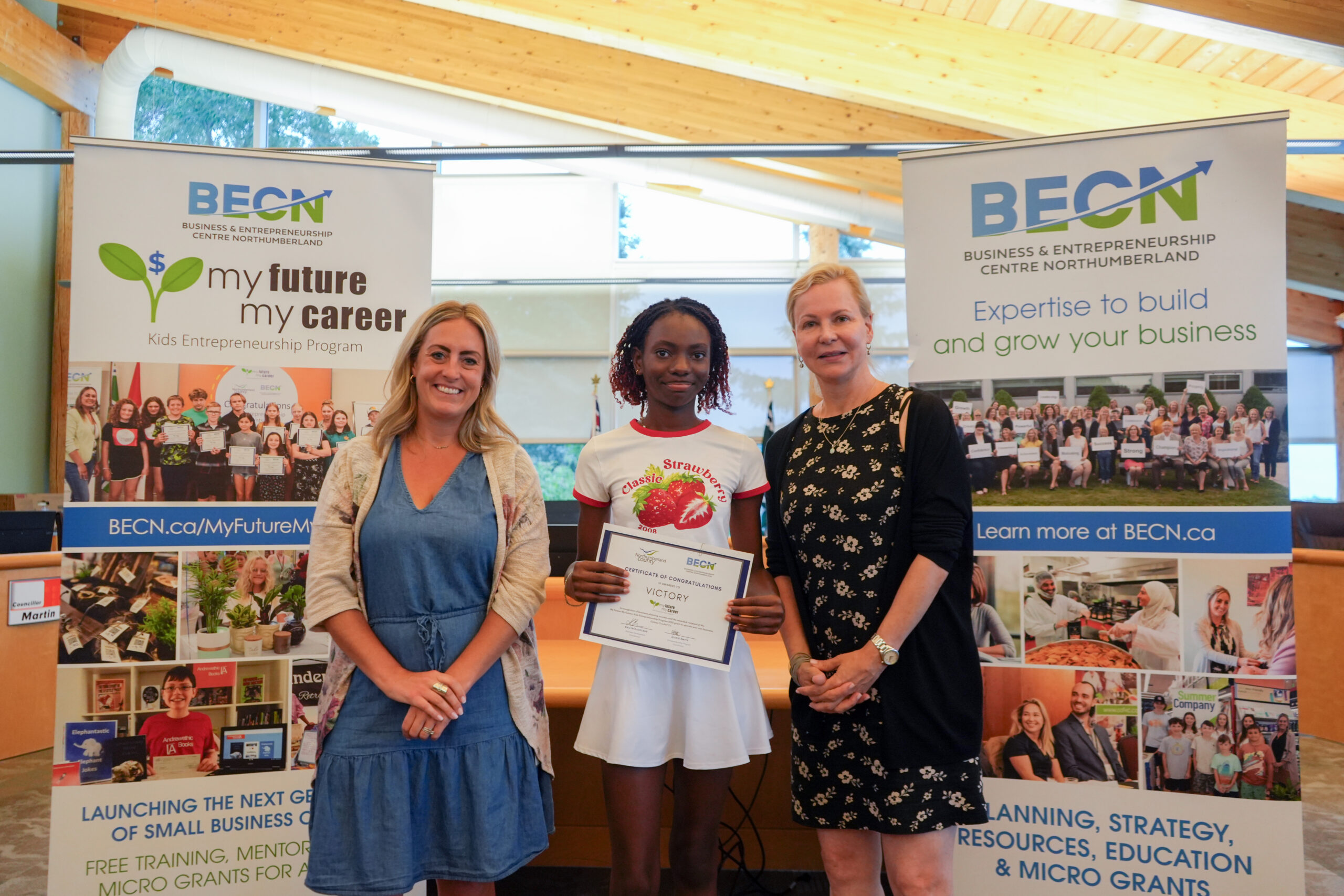Young girl receives micro grant cheque from My Future My Career Kids Entrepreneurship Program