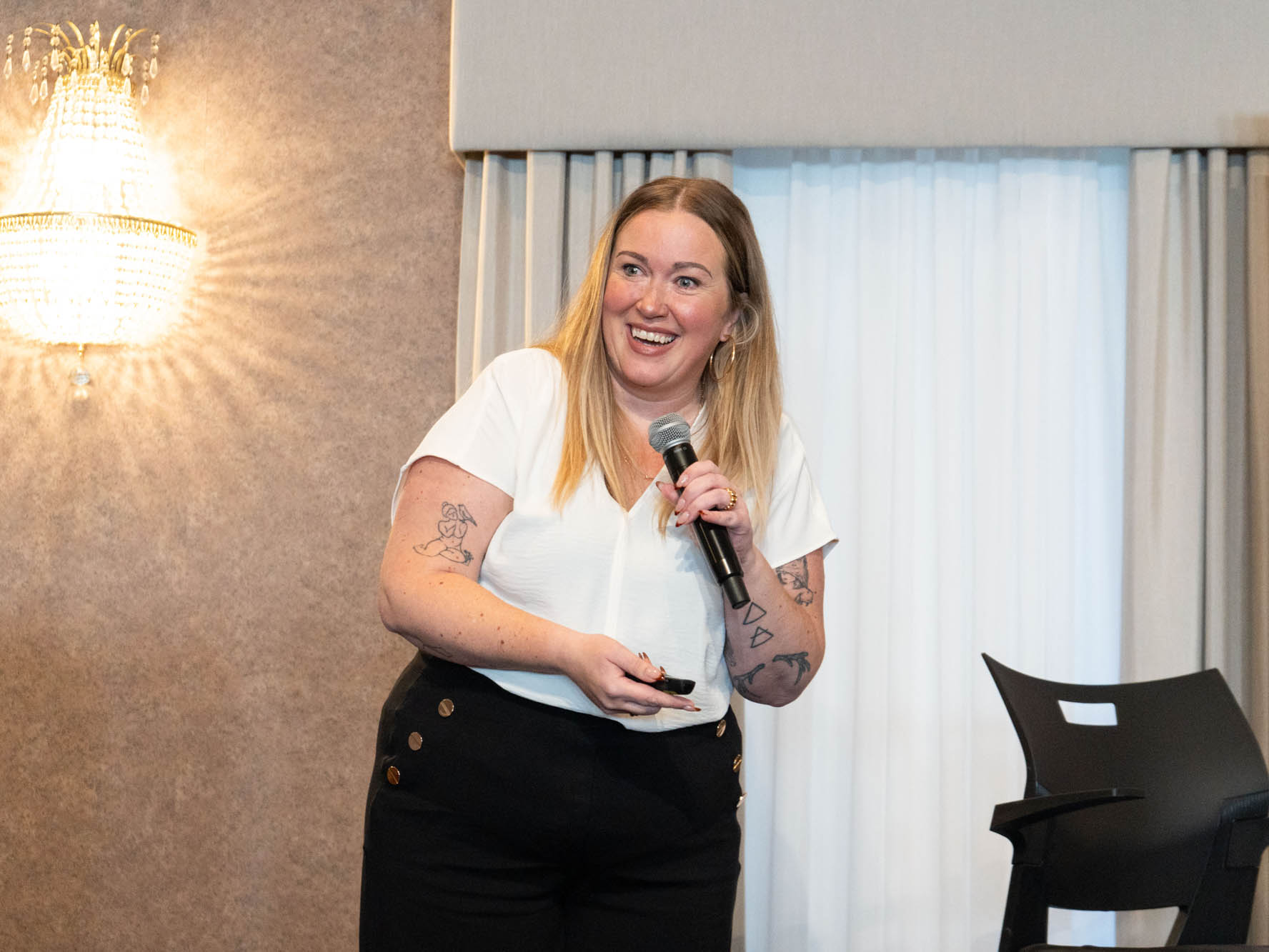 Photo of presenter at 2025 She Owns It Conference