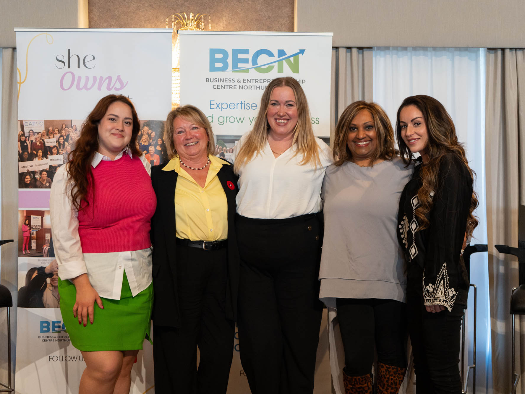 Photo of speakers at 2025 She Owns It Conference