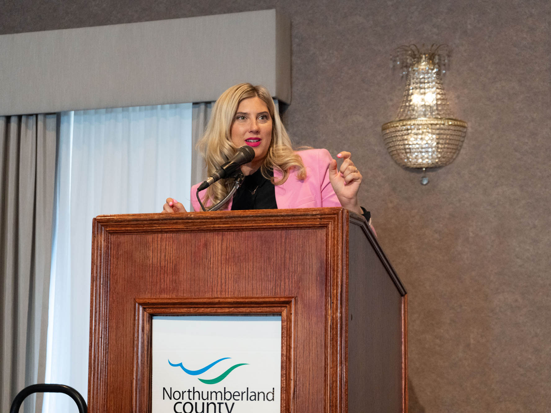 Photo of presenter at 2025 She Owns It Conference